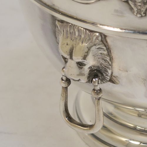 A handsome pair of Antique Edwardian Sterling Silver Monteith style bowls with rose grills, having round bodies with applied scroll borders, with cast lion-mask handles either side, and all sitting on pedestal feet. These elegant silver rose bowls were made by Jays of Chester in 1906. The dimensions of these fine hand-made antique silver Montieth rose bowls are diameter 14 cms (5.5 inches), height 11 cms (4.25 inches), and they weigh a total of approx. 800g (25.8 troy ounces). Please note that this item is part-crested.  