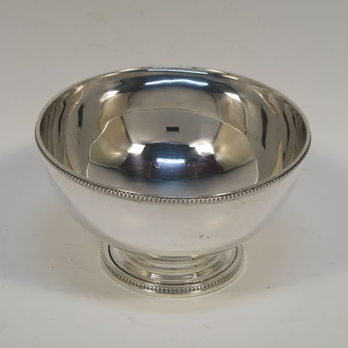 A pretty Antique Victorian Sterling Silver Georgian style small table bowl, having a plain round body, with applied bead-edged borders, and sitting on a pedestal foot. This elegant silver bowl was made in Sheffield in 1868. The dimensions of this fine hand-made antique silver bowl are diameter 10 cms (4 inches), height 6 cms (2.3 inches), and it weighs approx. 96g (3 troy ounces).  