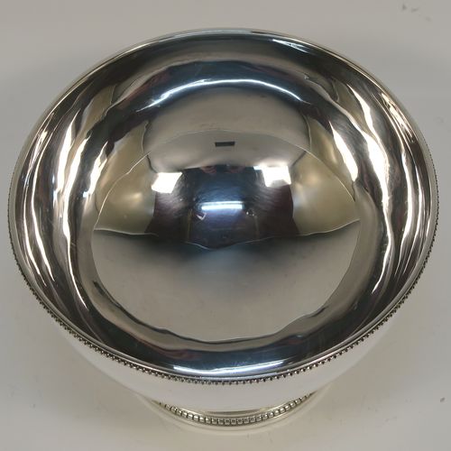 A pretty Antique Victorian Sterling Silver Georgian style small table bowl, having a plain round body, with applied bead-edged borders, and sitting on a pedestal foot. This elegant silver bowl was made in Sheffield in 1868. The dimensions of this fine hand-made antique silver bowl are diameter 10 cms (4 inches), height 6 cms (2.3 inches), and it weighs approx. 96g (3 troy ounces).  