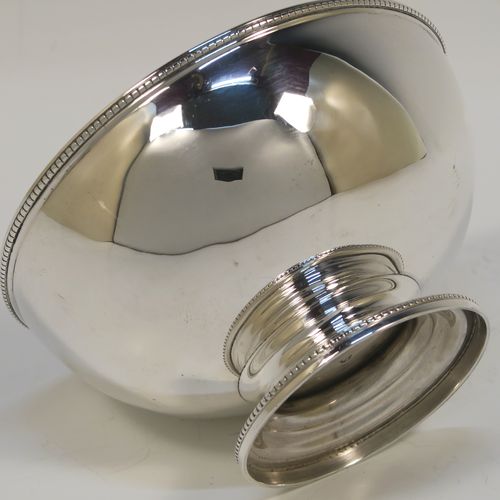 A pretty Antique Victorian Sterling Silver Georgian style small table bowl, having a plain round body, with applied bead-edged borders, and sitting on a pedestal foot. This elegant silver bowl was made in Sheffield in 1868. The dimensions of this fine hand-made antique silver bowl are diameter 10 cms (4 inches), height 6 cms (2.3 inches), and it weighs approx. 96g (3 troy ounces).  