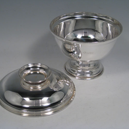 Sterling silver bowl and cover (or paten), having a very plain round body, with a pull-off lid, and sitting on a collet foot. Made by Jay Richard Attenborough and Co., of Chester in 1915. The dimensions of this fine hand-made silver bowl and cover are height 12.5 cms (5 inches), diameter 14.5 (5.75 inches), and the total weight is approx. 505g (16.3 troy ounces).