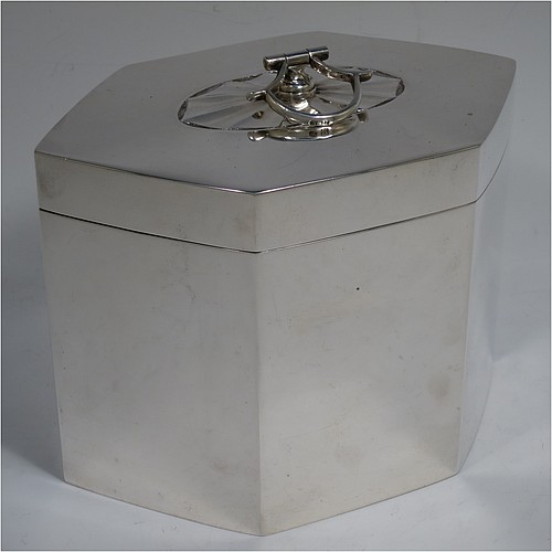 A very handsome and unusual Antique Edwardian Sterling Silver table box, having a hexagonal shaped body with plain straight sides, a hinged lid with an oval fluted centre and hinged loop handle, and all sitting on a flat base. Made by Thomas Bradbury and Sons of Sheffield in 1908. The dimensions of this fine hand-made antique silver table box are height 13 cms (5 inches), length 17 cms (6.75 inches), width 11 cms (4.3 inches), and it weighs approx. 682g (22 troy ounces).    