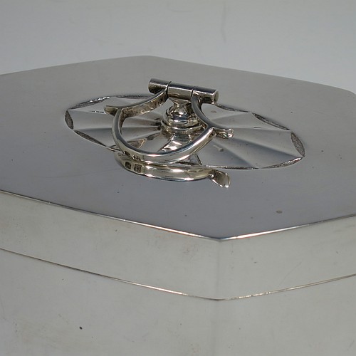 A very handsome and unusual Antique Edwardian Sterling Silver table box, having a hexagonal shaped body with plain straight sides, a hinged lid with an oval fluted centre and hinged loop handle, and all sitting on a flat base. Made by Thomas Bradbury and Sons of Sheffield in 1908. The dimensions of this fine hand-made antique silver table box are height 13 cms (5 inches), length 17 cms (6.75 inches), width 11 cms (4.3 inches), and it weighs approx. 682g (22 troy ounces).    