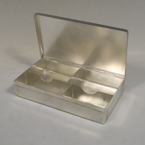 A very elegant Antique Victorian Sterling Silver  table or desk box, having a rectangular body with engine-turned decoration, a vacant round cartouche on the hinged lid, a compartmentalised interior, and all sitting of a flat base. This handsome antique silver box was made by Charles and George Asprey of London in 1896. The dimensions of this fine hand-made antique silver table box are length 18.5 cms (7.25 inches), width 11 cms (4.25 inches), height 3.5 cms (1.3 inches), and it weighs approx. 569g (18.4 troy ounces)  