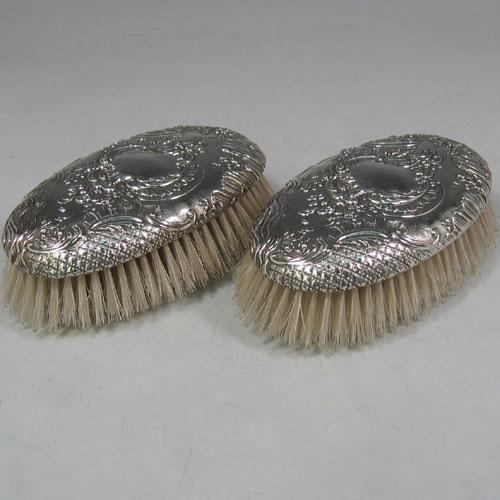 Antique Victorian sterling silver pair of clothes/hair brushes originally Dutch in origin, and made in ca 1890. Length 12 cms.