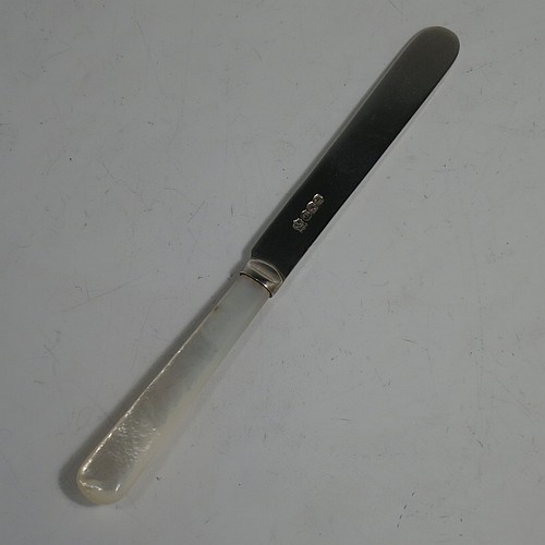 A Sterling Silver and Mother-of-Pearl handled set of six butter or tea knives, having plain mother-of-pearl handles, and plain silver parallel sided and rounded-end blades, all in their original cream satin and black velvet-lined presentation box. Made by Charles Boyton & Sons of Sheffield in 1966. The dimensions of this fine hand-made set of tea or butter knives are length of each knife 15 cms (6 inches).