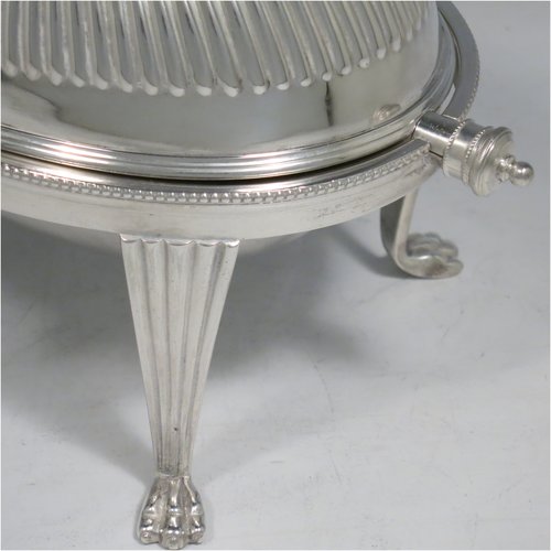 An Antique Victorian Silver Plated revolving top butter dish, having a hand-chased oval body with fluted decoration and bead-edged border, a frosted glass removable internal liner, and sitting on four cast lions paw feet. All made by Alexander Clark & Co., in ca. 1890. The dimensions of this fine hand-made antique silver-plated butter dish are length 22 cms (8.75 inches), height 14 cms (5.5 inches), and width 15 cms (6 inches).   