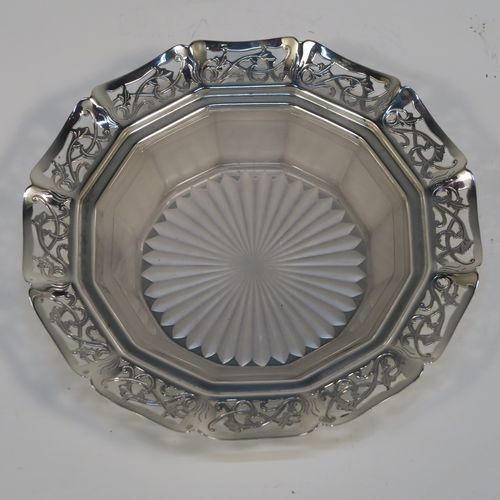 A very pretty Sterling Silver and crystal butter dish and cover, having a panelled lift-off lid with wooden finial, an original crystal liner with star-cut base sitting inside a panelled dish with hand-cut floral border and flat base. This beautiful antique silver butter dish and cover was made by Emile Viner of Sheffield in 1936. The dimensions of this fine hand-made silver butter dish and cover are diameter 15 cms (6 inches), height 8.5 cms (3.3 inch), with a total weight of approx. 286g (9.2 troy ounces).   