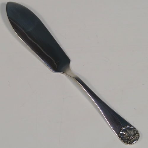 A very handsome Antique Victorian Sterling Silver butter shell and original butter knife, the shell having a hand-chased scalloped body, and sitting on three ball feet, the butter knife in the Old English Shell pattern, and all in their original blue satin and velvet-lined presentation box. Made by John & William Deakin of Sheffield in 1896. The dimensions of this fine hand-made antique silver butter dish and knife are length of dish 10 cms (4 inches), width 8.5 cms (3.25 inches), length of knife 10.5 cms (4.25 inches), and they weigh a total of approx 47g (1.5 troy ounces).   