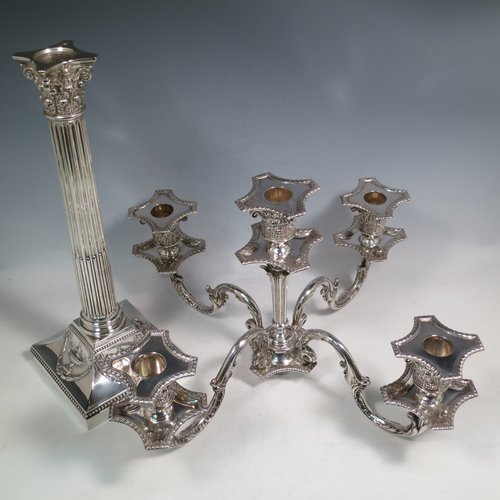 An Antique Victorian Sterling Silver single five-light candelabrum in a Corinthian style having Neoclassical hand-chased decoration, sitting on a square base, a fluted column with acanthus leaf style arms and capitals, removable nozzles with drip pans, and gadroon edge borders. Made by Elkington & Co., of Birmingham in 1895. The dimensions of this fine hand-made antique silver candelabrum are height 52 cms (20.5 inches), and spread across arms 38 cms (15 inches). Please note that this item can be converted into a three-light candelabrum.