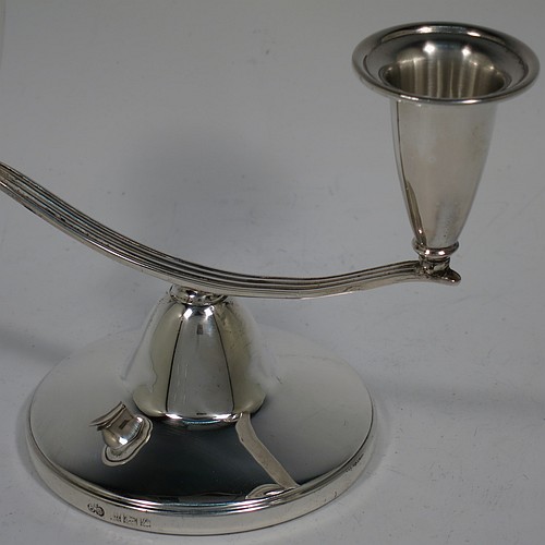 An unusual Sterling Silver pair of small two-light candelabra, having round bases with a cast reeded arms, with two attached plain round candle-holders. Made by Elkington and Co., of Birmingham in 1989. The dimensions of this fine hand-made pair of silver candelabra are height 11 cms (4.25 inches), and spread across arms 15 cms (6 inches).    