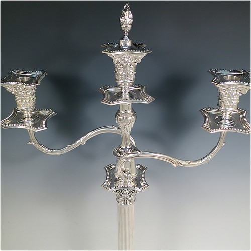 A very pretty Antique Victorian Sterling Silver single candelabrum, having three lights in a Corinthian style with a stepped square base, a fluted round column, double swirl acanthus leaf arms and capitals, removable nozzles with drip pans and central extinguisher with cast flame finial, and bead-edged borders. Made by Fordham and Faulkner of London in 1897. The dimensions of this fine hand-made antique silver single candelabrum are height 63.5 cms (25 inches), and spread across arms 38 cms (15 inches).    