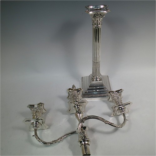 A very pretty Antique Victorian Sterling Silver single candelabrum, having three lights in a Corinthian style with a stepped square base, a fluted round column, double swirl acanthus leaf arms and capitals, removable nozzles with drip pans and central extinguisher with cast flame finial, and bead-edged borders. Made by Fordham and Faulkner of London in 1897. The dimensions of this fine hand-made antique silver single candelabrum are height 63.5 cms (25 inches), and spread across arms 38 cms (15 inches).    