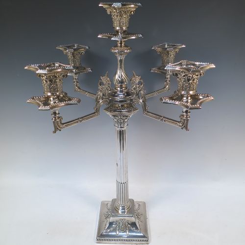 A very pretty and large pair of Antique Victorian Silver Plated five-light Corinthian style candelabra, having fluted columns, acanthus-leaf capitals, stepped bases, with bead-edge borders, and removable arms with drip pans and nozzles. Please note that these can be converted to a pair of three-light candelabra. Made by Hawksworth Eyre and Co. of Sheffield in ca. 1880. The dimensions of this fine hand-made pair of silverplated five-light candelabra are height 56 cms (22 inches), and spread across arms 39 cms (15.3 inches).   