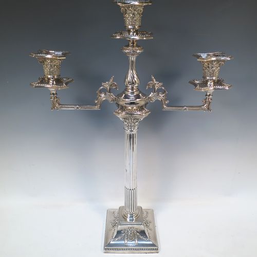 A very pretty and large pair of Antique Victorian Silver Plated five-light Corinthian style candelabra, having fluted columns, acanthus-leaf capitals, stepped bases, with bead-edge borders, and removable arms with drip pans and nozzles. Please note that these can be converted to a pair of three-light candelabra. Made by Hawksworth Eyre and Co. of Sheffield in ca. 1880. The dimensions of this fine hand-made pair of silverplated five-light candelabra are height 56 cms (22 inches), and spread across arms 39 cms (15.3 inches).   