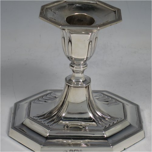 An Antique Victorian Sterling Silver pair of small candlesticks, having octagonal bases with hand-chased  fluted decoration, reed-edged borders, and removable nozzles. Made by Martin & Hall of Sheffield in 1901. The dimensions of these fine hand-made antique silver candlesticks are height 10 cms (4 inches), and the bases are 11 cms (4.3 inches) long, by 8.5 cms (3.3 inches).   