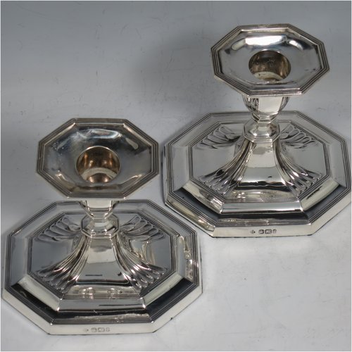 An Antique Victorian Sterling Silver pair of small candlesticks, having octagonal bases with hand-chased  fluted decoration, reed-edged borders, and removable nozzles. Made by Martin & Hall of Sheffield in 1901. The dimensions of these fine hand-made antique silver candlesticks are height 10 cms (4 inches), and the bases are 11 cms (4.3 inches) long, by 8.5 cms (3.3 inches).   