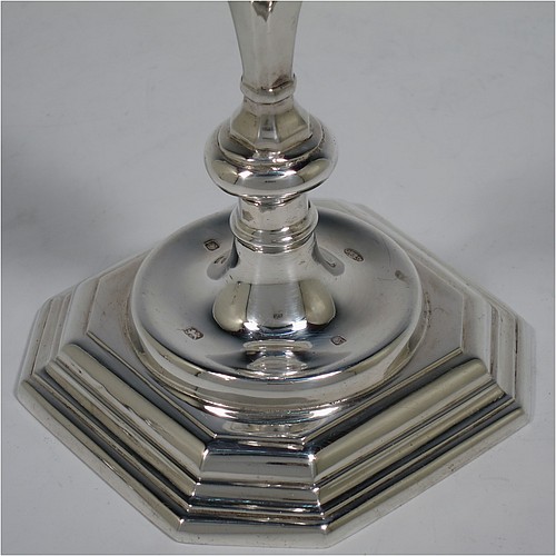 A very handsome Sterling Silver pair of cast candlesticks in a George I style, having octagonal baluster bodies, and sitting on hexagonal bases. Made in London in 1992. The dimensions of these fine hand-made cast silver table candlesticks are height 17 cms (6.75 inches), and the bases are 10 cms (4 inches) square.    