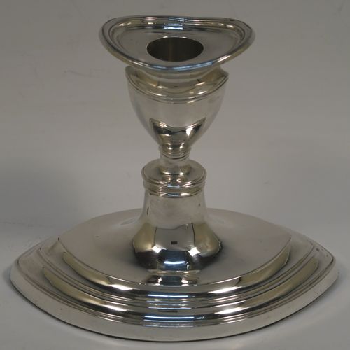 A very handsome pair of Antique Sterling Silver candlesticks, having plain oval boat-shaped bodies with reeded borders, and original removable nozzles. These elegant antique silver candlesticks were made by Williams Ltd., of Birmingham in 1911. The dimensions of these fine hand-made antique silver candlesticks are height 11.5 cms (4.5 inches), and the bases are 14 cms (5.5 inches) long.   