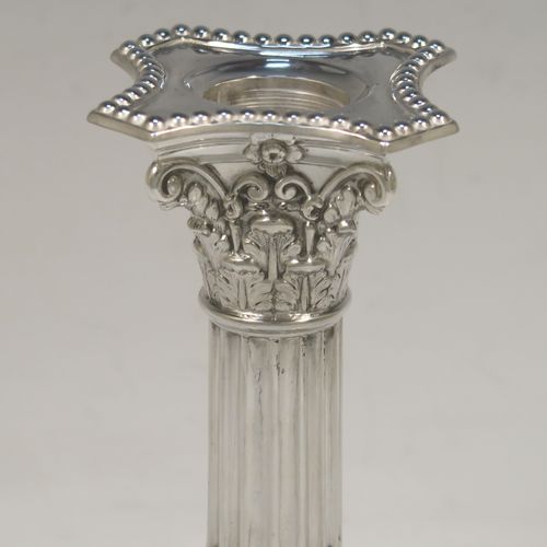 A very pretty pair of Antique Edwardian Sterling Silver of Corinthian style candlesticks, having bead-edged borders, acanthus-leaf capitals, fluted columns, removable nozzles, and square stepped bases. These beautiful antique silver candlesticks were made by James Dixon and Sons of Sheffield in 1907. The dimensions of this fine hand-made pair of antique silver candlesticks are height 17 cms (6.75 inches), and the bases are 9 cms (3.5 inches) square.   