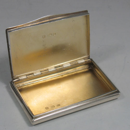 Antique Georgian sterling silver calling card case, having a rectangular body, with hand-engraved wavey-work decoration, a central cartouche with Ducal Coronet, a gold-gilt interior, and a side-hinged lid with thumb-piece. Made by Thomas Shaw of Birmingham in ca. 1820. The dimensions of this fine hand-made silver card case are length 8.5 cms (3.3 inches), width 5.5 cms (2.25 inches), and it weighs approx. 100g (3.2 troy ounces).