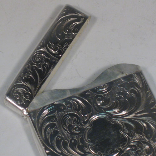 Antique Victorian sterling silver calling card case, having a rectangular body with hand-engraved floral decoration, and a side-hinged lid. Made by Francis Clark of Birmingham in 1847. The dimensions of this fine hand-made silver card case are length 9.5 cms (3.75 inches), width 7 cms (2.75 inches), and it weighs approx. 82g (2.6 troy ounces).   