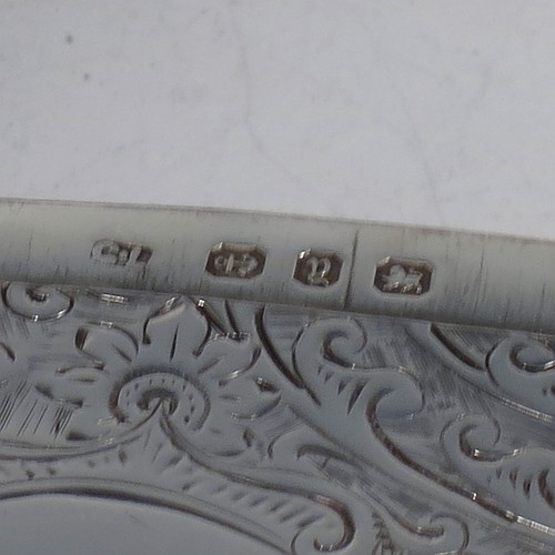 A very pretty Antique Victorian Sterling Silver calling card case, having a rectangular body with rounded shoulders, hand-engraved floral decoration, a vacant central cartouche on one side, and a side-hinged lid. Made by George Loveridge of Birmingham in 1898. The dimensions of this fine hand-made antique silver card case are length 10 cms (4 inches), width 7.5 cms (3 inches), and it weighs approx. 88g (2.8 troy ounces).   