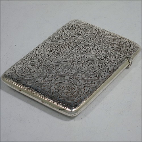 A very pretty Antique Victorian Sterling Silver calling card case, having a rectangular body with rounded shoulders, hand-engraved floral decoration, a vacant central cartouche on one side, and a side-hinged lid. Made by George Loveridge of Birmingham in 1898. The dimensions of this fine hand-made antique silver card case are length 10 cms (4 inches), width 7.5 cms (3 inches), and it weighs approx. 88g (2.8 troy ounces).   