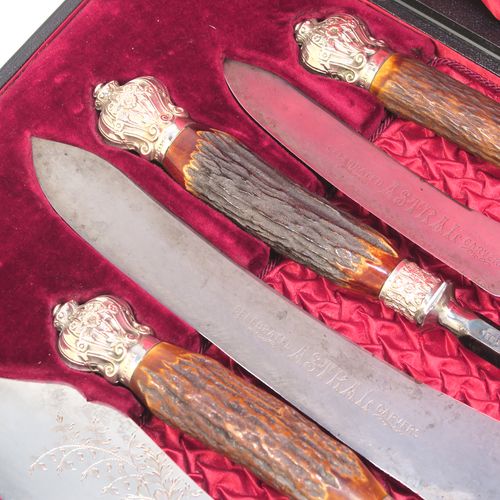 A very handsome, large, and complete seven-piece Antique Victorian Silver Plated and deer antler horn meat carving set with fish servers, consisting of two forks with working guards, two knives, one sharpening steel, one fish serving fork fork, and one fish knife with hand-engraved gingko and fern leaves, all with bone antler handles and silver ferrules with hand-chased fluting and floral decoration, all in their original maroon velvet and crimson silk lined presentation box. This beautiful original carving set was made in ca. 1895 with a design registration mark. The dimensions of this fine hand-made antique silver and antler bone handled carving set are length of longest knife 39 cms (15.3 inches), and length of forks 29 cms (11.5 inches).   