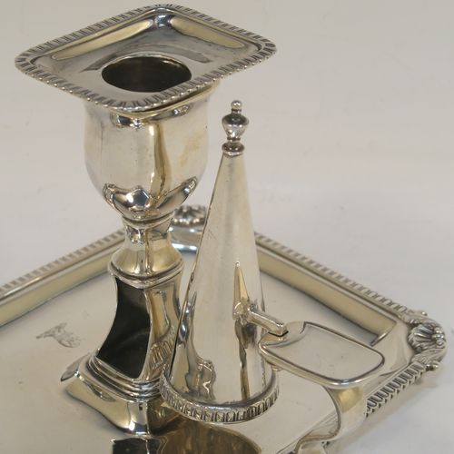 A handsome Antique Georgian Sterling Silver Regency style chamberstick, having a rectangular body with a gadroon & shell border, a side-handle with original removable snuffer, and an original drip-pan nozzle. This elegant antique silver chamberstick was made by Peter and William Bateman of London in 1812. The dimensions of this fine hand-made silver chamberstick are height 11 cms (4.25 inches), length 16 cms (6.25 inches), width 12.5 cms (5 inches), and with a total weight of approx. 352g (11.4 troy ounces). Please note that this item is part crested.