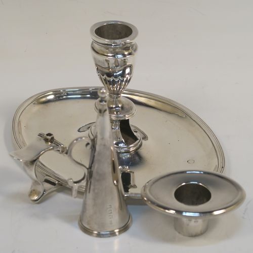 A very handsome Antique Georgian Sterling Silver chamber-stick, having an oval body, a plain scroll handle with thumb-piece, an original removable dunce-cap extinguisher, an original removable nozzle, and with applied reed-edged borders. This elegant silver chamberstick was made by William Abdy II of London in 1798. The dimensions of this fine hand-made antique silver chamberstick are length 16 cms (6.3 inches), width 14 cms (5.5 inches), height 8 cms (3 inches), and it weighs approx. 261g (8.4 troy ounces).   