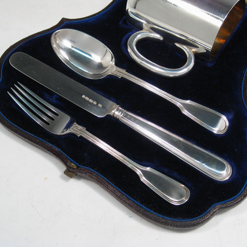 Antique Victorian sterling silver christening set consisting of a plain christening mug with loop handle, and a knife, fork, and spoon in the Fiddle and Thread pattern, all in original blue satin and velvet-lined presentation box. Made by the Savory Brothers of London in 1879. Height of mug 8 cms (3 inches), length of knife 19 cms (7.5 inches). Total weight approx. 251g (8 troy ounces).