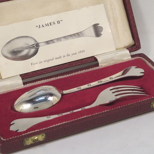 A very handsome Sterling Silver christening set, having a fork and spoon in the plain Trefid End James II pattern, and all sitting in their original cream satin and maroon velvet-lined presentation box. This elegant silver christening set was made by Francis Higgins of Sheffield in 1968. The dimensions of this fine hand-made silver christening set are length of spoon 14 cms (5.5 inches), with a total weight of approx. 51g (1.6 troy ounces).   