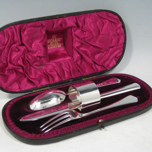 Antique Victorian sterling silver christening set consisting of a plain round napkin ring, and a knife, fork, and spoon in the Rattail Dognose pattern, all in original maroon satin and velvet-lined presentation box. Made by the Barnard Brothers of London in 1890. The dimensions of this fine hand-made silver christening set are length of knife 21 cms (8.25 inches), diameter of napkin ring 4 cms (1.5 inches), and it has a total weight of approx. 166g (5.4 troy ounces).   