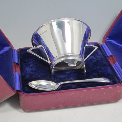 Sterling silver Art Deco christening set consisting of a two-handled bowl and spoon in original blue satin and velvet-lined presentation box. Made by James Dixon & Sons of Sheffield in 1912. The dimensions of this fine hand-made silver christening set are diameter of bowl 10 cms (4 inches), length of spoon 14 cms (5.5 inches), and with a total weight of approx. 187g (6 troy ounces).