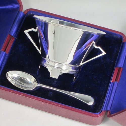 Sterling silver Art Deco christening set consisting of a two-handled bowl and spoon in original blue satin and velvet-lined presentation box. Made by James Dixon & Sons of Sheffield in 1912. The dimensions of this fine hand-made silver christening set are diameter of bowl 10 cms (4 inches), length of spoon 14 cms (5.5 inches), and with a total weight of approx. 187g (6 troy ounces).