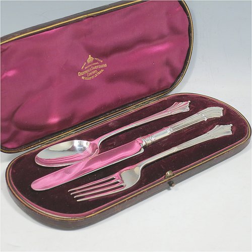 An Antique Victorian Sterling Silver christening set, having a knife, fork, and spoon, all with Albany pattern handles, and all sitting in their original purple satin and velvet-lined presentation box. Made by the William Gibson & John Lawrence of London in 1886 (for Goldsmiths & Silversmiths). The dimensions of this fine hand-made silver christening set are length of knife 20 cms (8 inches), with a total weight of approx. 125g (4 troy ounces).   