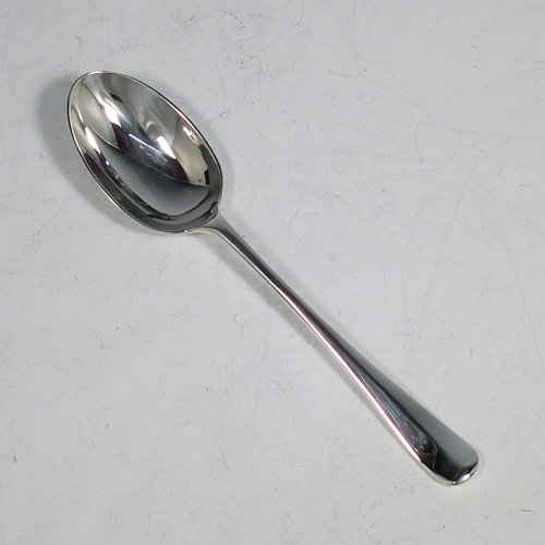 A Sterling Silver christening set, consisting of a plain round baluster bowl sitting on a flat base and a plain Hanoverian pattern spoon, all sitting in an original dark blue satin and velvet-lined presentation box. Made by Walker & Hall of Sheffield in 1931. The dimensions of this fine hand-made silver christening set are length of spoon 14 cms (5.5 inches), diameter of bowl 11 cms (4.3 inches), and the total weight is approx. 185g (6 troy ounces).    