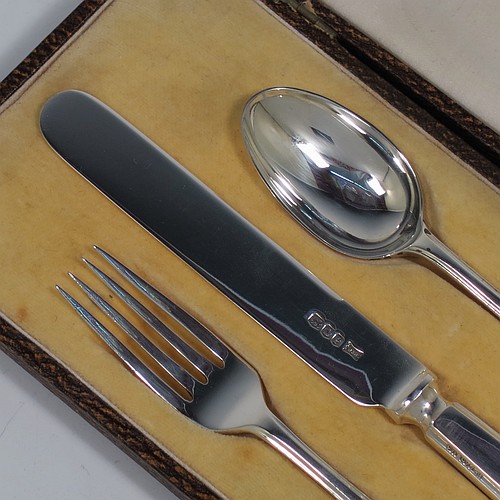 A very handsome Art Deco style Sterling Silver christening set, having a knife, fork, and spoon, all sitting in their original white satin and cream velvet-lined presentation box. Made by Walker and Hall of Sheffield in 1932. The dimensions of this fine hand-made silver christening set are length of knife 19 cms (7.5 inches), with a total weight of approx. 93g (3 troy ounces).    