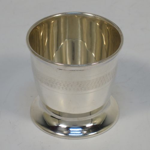 A handsome Art Deco style Sterling Silver three-piece christening set, consisting of a napkin ring, egg cup, and spoon, all with engine-turned decoration, and in their original cream satin and black velvet-lined presentation box. Made by William Base and Sons of Sheffield in 1925. The dimensions of this fine hand-made silver christening set are length of spoon 11 cms (4.3 inches), diameter of napkin ring 4 cms (1.6 inches), height of egg cup 4.5 cms (1.75 inches), and the total weight is approx. 66g (2.1 troy ounces).  