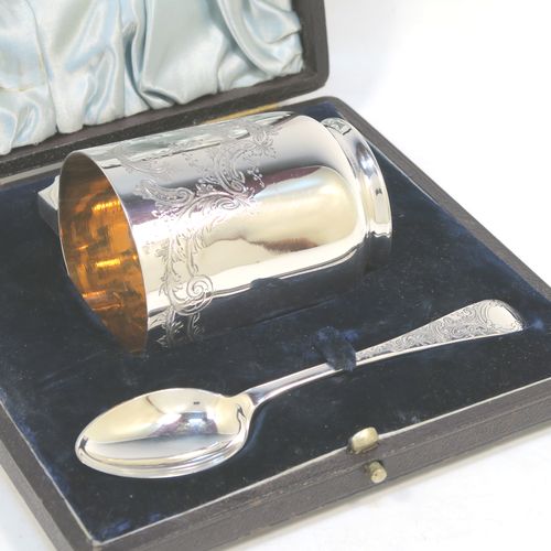 A very pretty Antique Victorian Sterling Silver christening set, consisting of a christening mug and spoon, all with hand-engraved floral decoration, and the mug with a gold-gilt interior, all sitting in an original dark and light blue satin and velvet-lined presentation box. Made by Walker and Hall of Sheffield in 1901. The dimensions of this fine hand-made antique silver christening set are length of spoon 13.5 cms (5.25 inches), height of mug 8 cms (3 inches), diameter at lip 6 cms (2.3 inches), and the total weight is approx. 175g (5.6 troy ounces).   