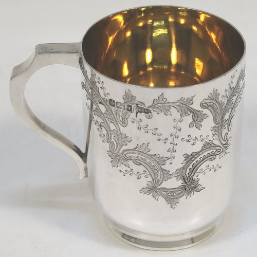 A very pretty Antique Victorian Sterling Silver christening set, consisting of a christening mug and spoon, all with hand-engraved floral decoration, and the mug with a gold-gilt interior, all sitting in an original dark and light blue satin and velvet-lined presentation box. Made by Walker and Hall of Sheffield in 1901. The dimensions of this fine hand-made antique silver christening set are length of spoon 13.5 cms (5.25 inches), height of mug 8 cms (3 inches), diameter at lip 6 cms (2.3 inches), and the total weight is approx. 175g (5.6 troy ounces).   