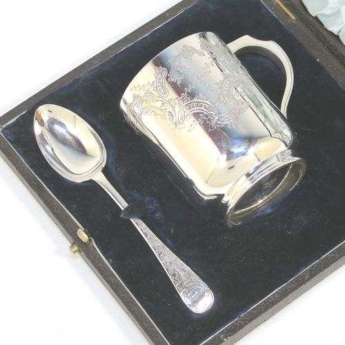 A very pretty Antique Victorian Sterling Silver christening set, consisting of a christening mug and spoon, all with hand-engraved floral decoration, and the mug with a gold-gilt interior, all sitting in an original dark and light blue satin and velvet-lined presentation box. Made by Walker and Hall of Sheffield in 1901. The dimensions of this fine hand-made antique silver christening set are length of spoon 13.5 cms (5.25 inches), height of mug 8 cms (3 inches), diameter at lip 6 cms (2.3 inches), and the total weight is approx. 175g (5.6 troy ounces).   