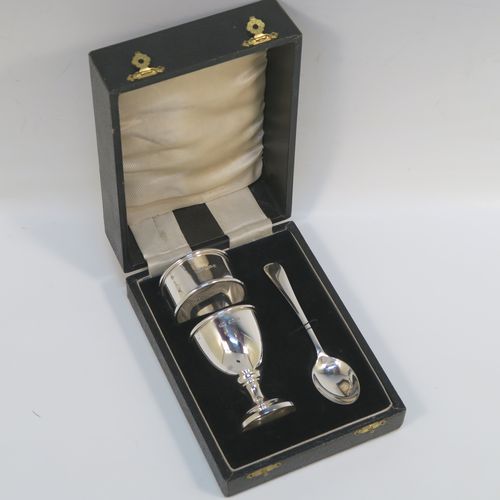 A handsome Sterling Silver three-piece christening set, consisting of a plain round napkin ring, a plain round egg cup, and a plain Old English pattern spoon, all in their original cream satin and black velvet-lined presentation box. This elegant christening set was made by Price and Co.,  of Birmingham in 1933. The dimensions of this fine hand-made silver christening set are length of spoon 11 cms (4.25 inches), diameter of napkin ring 4.5 cms (1.75 inches), and the total weight is approx. 41g (1.3 troy ounces).  