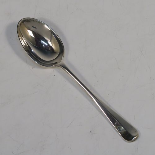 A large and handsome Sterling Silver pusher and spoon set, having a plain style with oval bowl, a plain pusher, both with Hanoverian pattern handles, and all sitting in their original cream satin and dark blue velvet-lined presentation box. This elegant silver christening set was made by Garrard and Co., of London in 1954. The dimensions of this fine hand-made silver christening set are length of spoon 14.5 cms (5.75 inches), and the total weight is approx. 55g (1.8 troy ounce).   