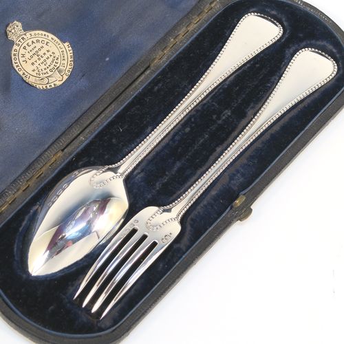 A very pretty Antique Victorian Sterling Silver christening set, having a fork and spoon in the double-struck Bead pattern, and all sitting in their original dark blue satin and velvet-lined presentation box. This beautiful antique silver christening set was made by Henry Holland of London in 1866. The dimensions of this fine hand-made antique silver christening set are length 16 cms (6.3 inches), with a total weight of approx. 68g (2.2 troy ounces)   