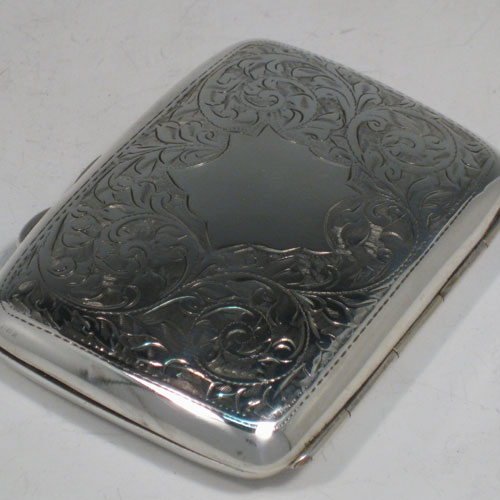    Sterling silver cigarello / cigarette case, having a rectangular shaped body with hand-engraved floral decoration, thumb-piece with catch, and gold-gilt interior. Length 8 cms (3.25 inches), width 6 cms (2.3 cms). Weight approx. 65g (2 troy ounces).