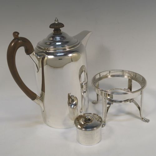 A large and very handsome Antique Georgian sterling silver coffee Biggin pot with an original spirit burner stand, having a very plain round body with straight sides, a brown fruit-wood handle, a pull-off lid with wooden finial, and sitting on a burner stand with four flange feet. This beautiful coffee Biggin pot and burner stand was made by Robert Keay I of Edinburgh in 1807. The dimensions of this fine hand-made coffee pot Biggin on burner stand are length 22 cms (8.75 inches), height 30.5 cms (12 inches), diameter of main body 11 cms (4.5 inches), and it weighs approx. 1,178g (38 troy ounces). 