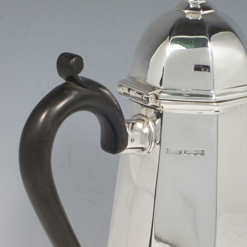 Sterling silver fine hand-made Queen Anne style coffee pot with plain panelled tapering body, hinged domed lid with finial, a panelled spout, and a scrolled wooden handle. Made by Henry Stratford Ltd., of Sheffield in 1921. The dimensions of this fine silver coffee pot are length 20 cms (8 inches), height 25.5 cms (10 inches), and it weighs approx. 650g (21 troy ounces).   