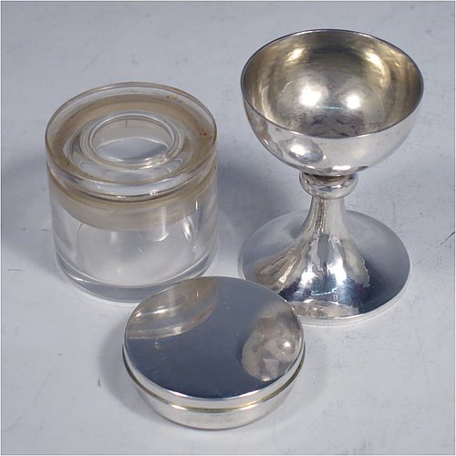 A rare Sterling Silver three-piece travelling communion set consisting of a hand-hammered chalice, pyx box with lid, and glass wine holder with stopper, all in their original silver cylindrical hinged travelling box with a hand-chased christogram. Made by Frederick Osborne & Co., of London in 1930. The dimensions of this fine hand-made silver travelling communion set are length of box 9.5 cms (3.75 inches), and diameter 4.5 cms (1.75 inches), and with a total weight of approx. 250g (8 troy ounces). Please note that it is very unusual to find an original pyx box in a travelling communion set.